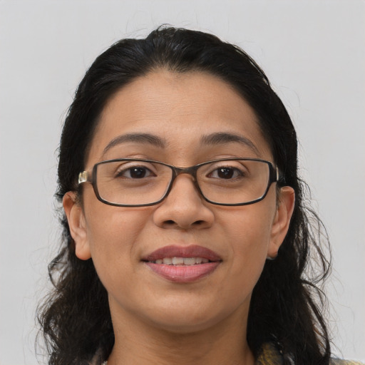 Joyful asian adult female with long  brown hair and brown eyes