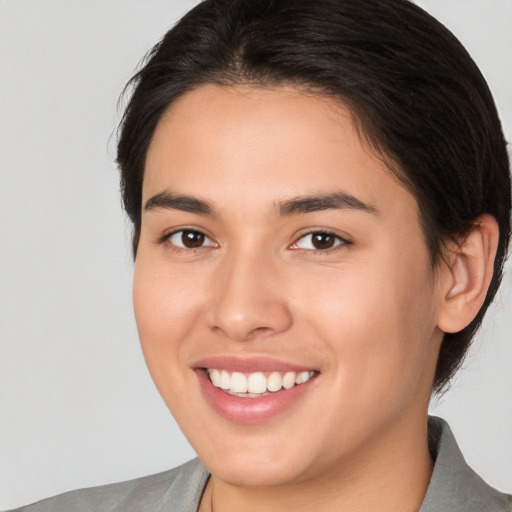 Joyful white young-adult female with medium  brown hair and brown eyes