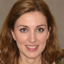 Joyful white young-adult female with medium  brown hair and green eyes