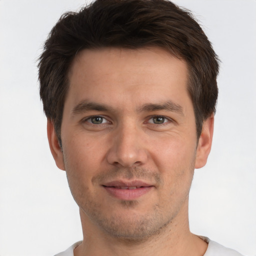 Joyful white adult male with short  brown hair and brown eyes