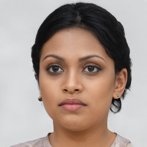 Neutral latino young-adult female with medium  black hair and brown eyes