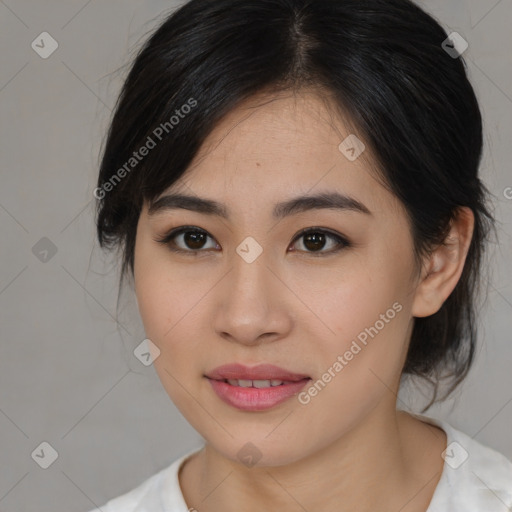 Joyful asian young-adult female with medium  black hair and brown eyes