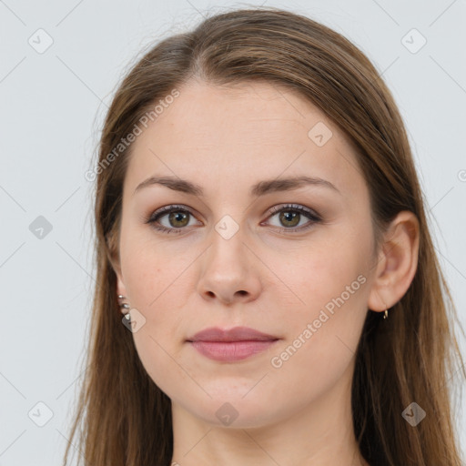 Joyful white young-adult female with long  brown hair and grey eyes