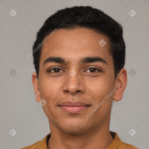 Joyful latino young-adult male with short  black hair and brown eyes