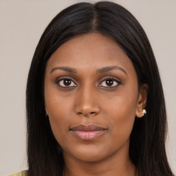 Joyful asian young-adult female with long  brown hair and brown eyes