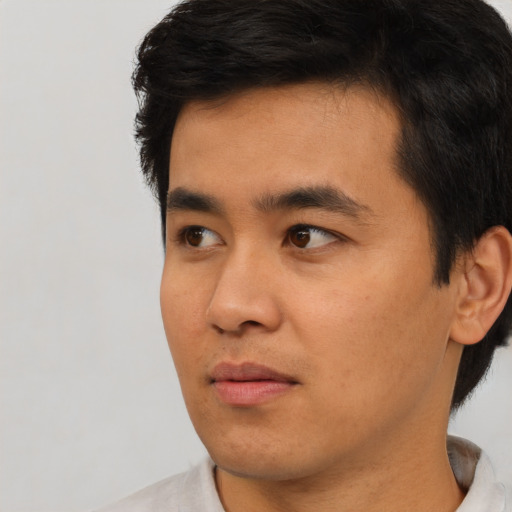Neutral asian young-adult male with short  black hair and brown eyes