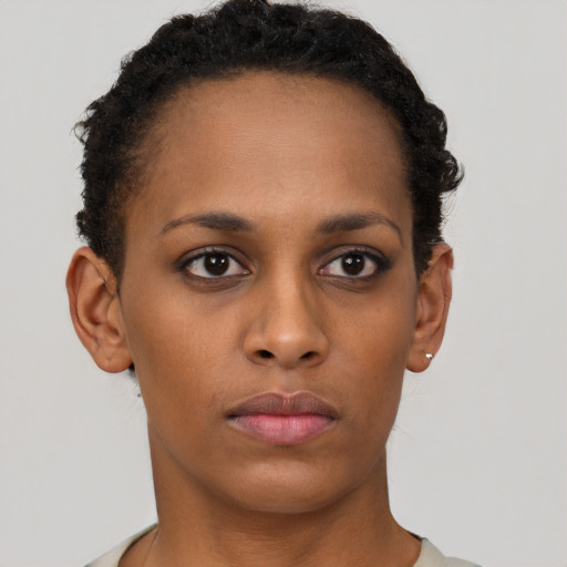 Neutral black young-adult female with short  brown hair and brown eyes
