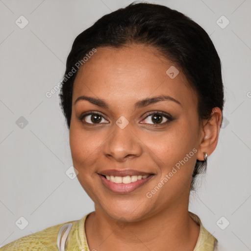 Joyful latino young-adult female with medium  brown hair and brown eyes