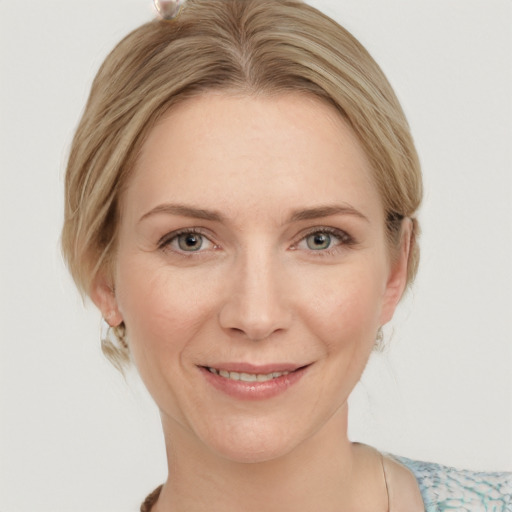 Joyful white young-adult female with medium  brown hair and blue eyes