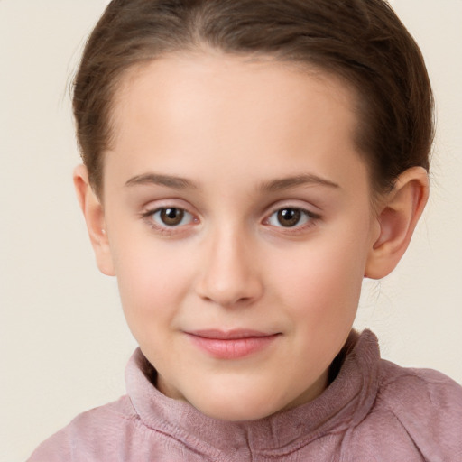 Joyful white child female with short  brown hair and brown eyes