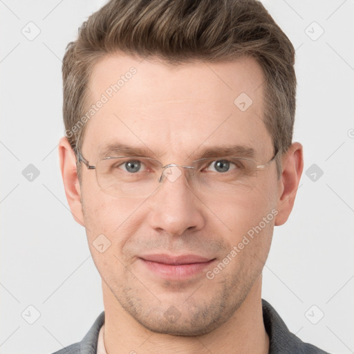 Joyful white adult male with short  brown hair and grey eyes