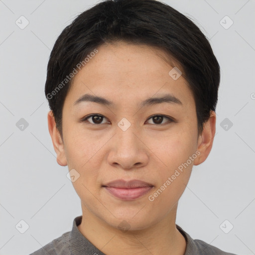 Joyful asian young-adult female with short  brown hair and brown eyes