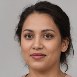 Joyful white young-adult female with medium  brown hair and brown eyes