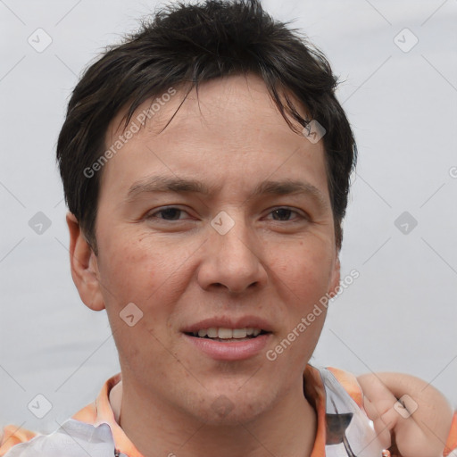 Joyful white adult male with short  brown hair and brown eyes