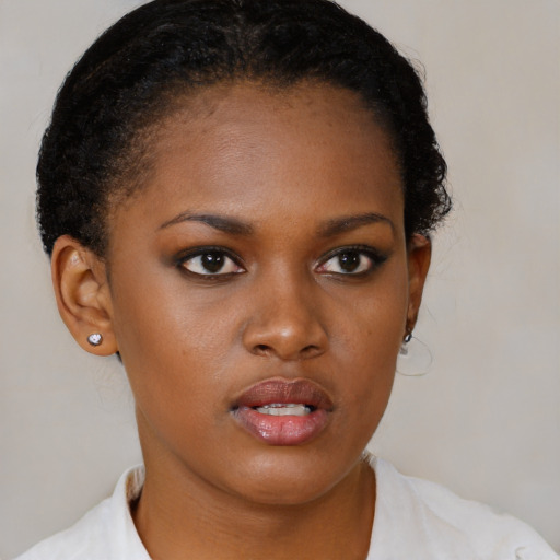 Neutral black young-adult female with short  brown hair and brown eyes
