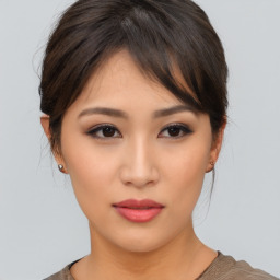 Neutral asian young-adult female with medium  brown hair and brown eyes