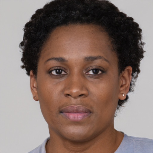 Neutral black young-adult female with short  brown hair and brown eyes