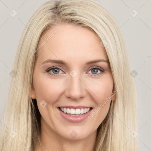 Joyful white young-adult female with long  brown hair and blue eyes