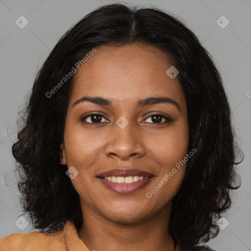 Joyful black young-adult female with long  brown hair and brown eyes