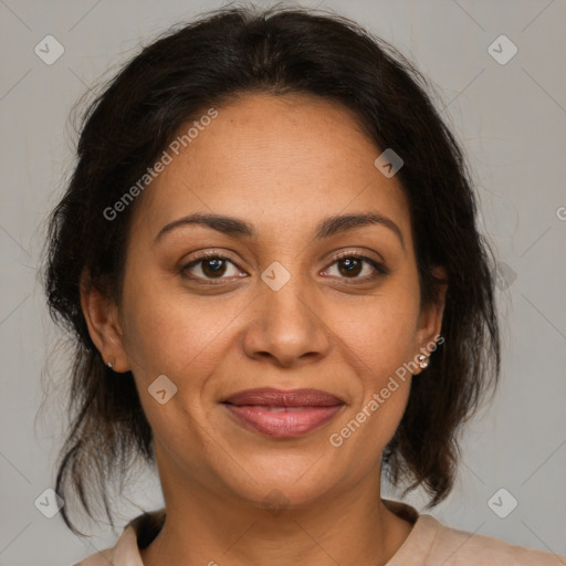Joyful latino adult female with medium  brown hair and brown eyes