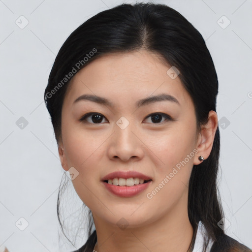 Joyful asian young-adult female with medium  black hair and brown eyes