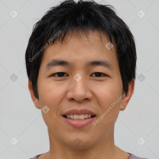 Joyful asian young-adult male with short  black hair and brown eyes