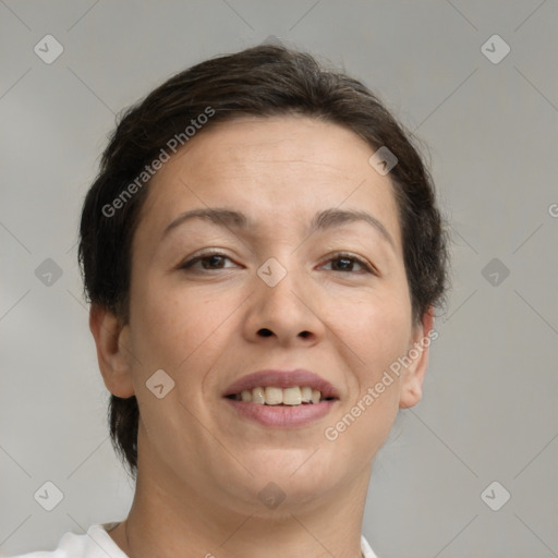 Joyful white adult female with short  brown hair and brown eyes