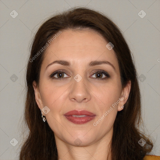 Joyful white adult female with long  brown hair and brown eyes