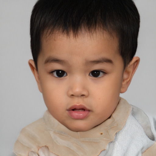 Neutral asian child male with short  brown hair and brown eyes