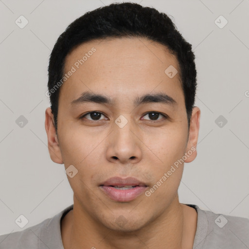 Neutral latino young-adult male with short  black hair and brown eyes