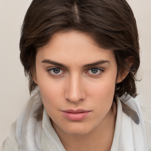 Neutral white young-adult female with medium  brown hair and brown eyes