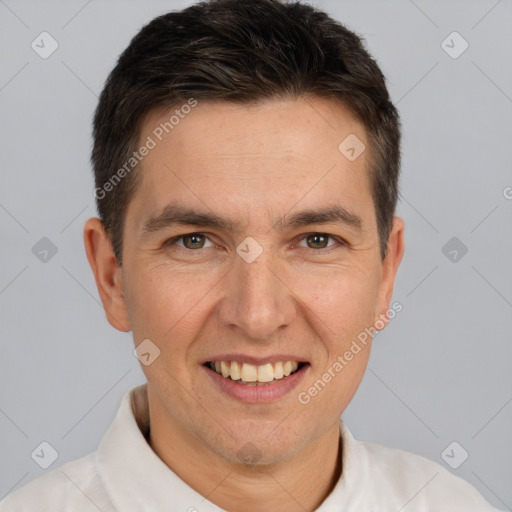 Joyful white adult male with short  brown hair and brown eyes