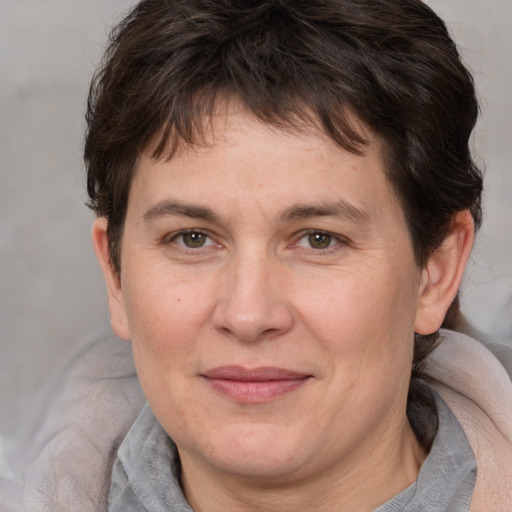 Joyful white adult male with medium  brown hair and brown eyes