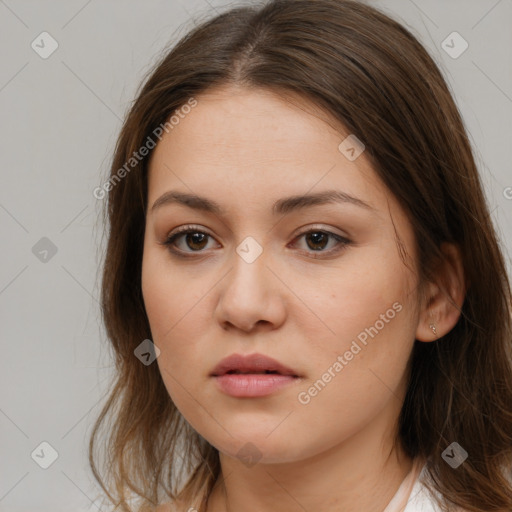 Neutral white young-adult female with long  brown hair and brown eyes