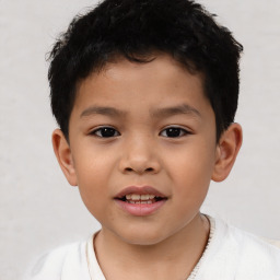 Joyful latino child male with short  brown hair and brown eyes