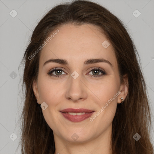 Joyful white adult female with long  brown hair and brown eyes