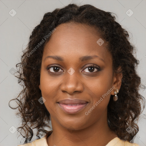 Joyful black young-adult female with medium  brown hair and brown eyes