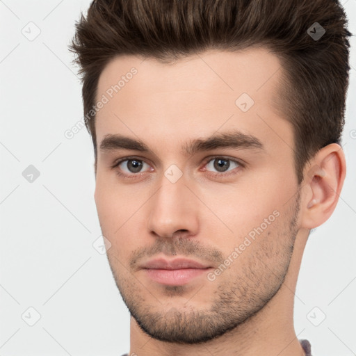 Neutral white young-adult male with short  brown hair and brown eyes