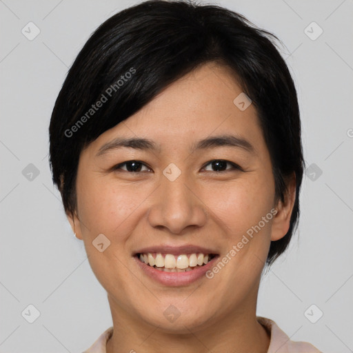 Joyful asian young-adult female with medium  black hair and brown eyes