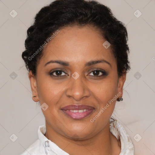 Joyful black adult female with short  brown hair and brown eyes