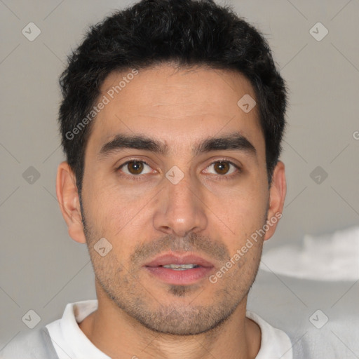 Joyful white young-adult male with short  black hair and brown eyes