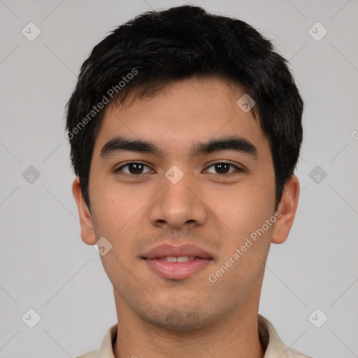 Joyful asian young-adult male with short  black hair and brown eyes