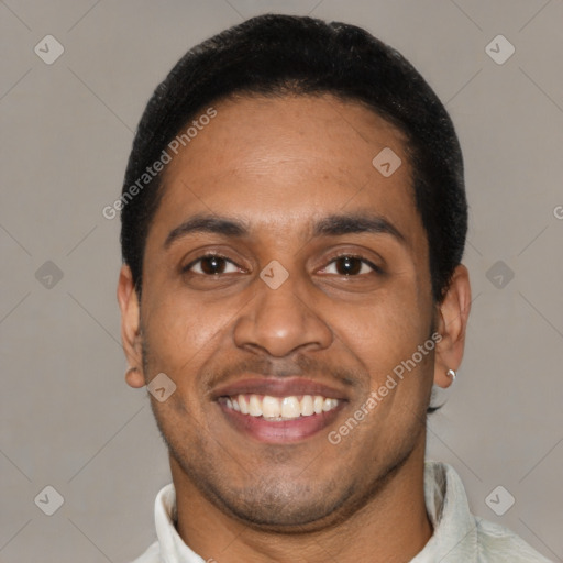 Joyful latino young-adult male with short  black hair and brown eyes