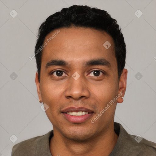 Joyful latino young-adult male with short  black hair and brown eyes
