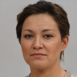 Joyful white adult female with short  brown hair and brown eyes