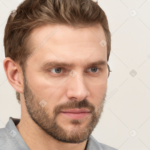 Joyful white adult male with short  brown hair and grey eyes