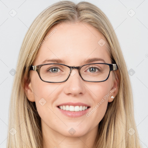 Joyful white young-adult female with long  brown hair and blue eyes