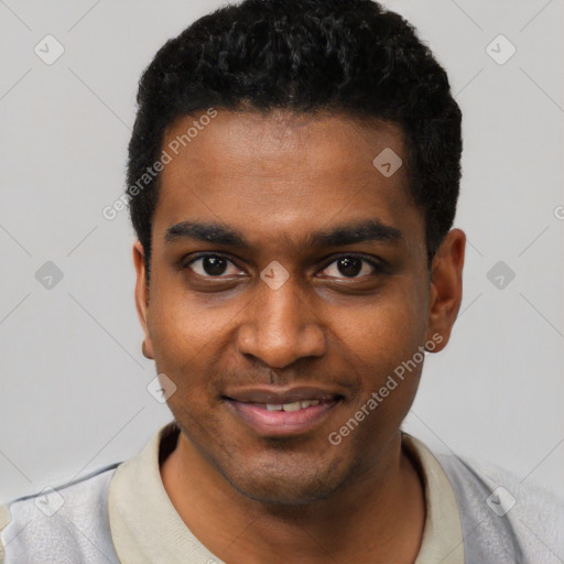 Joyful black young-adult male with short  black hair and brown eyes