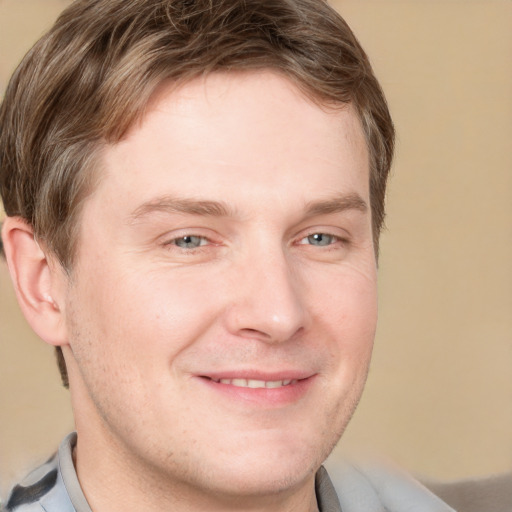 Joyful white adult male with short  brown hair and grey eyes