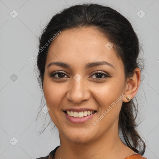 Joyful latino young-adult female with medium  brown hair and brown eyes